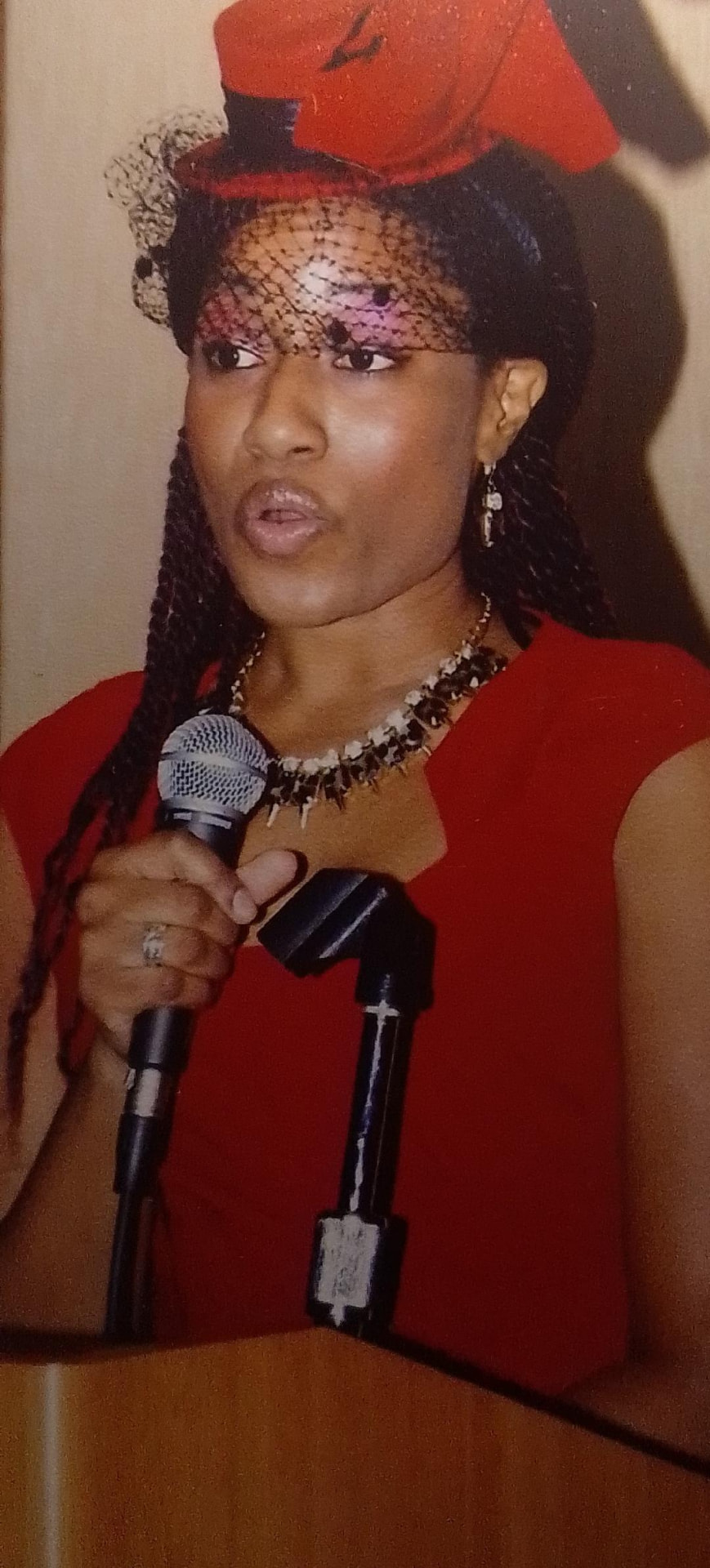 Sunni LaVasiette addressing an audience with a microphone